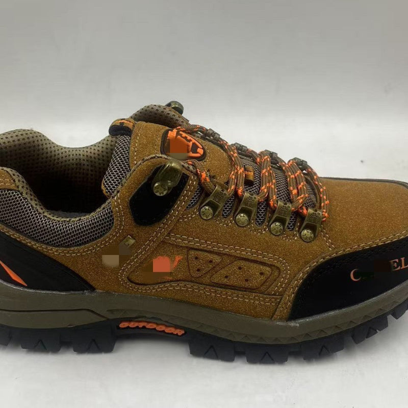 Tan hiking shoe with orange lace-up, perforated side panel, lace hardware, thick tread