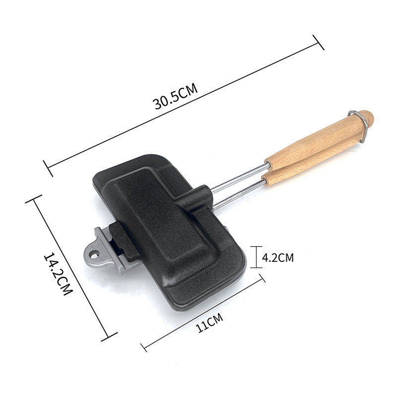 Compact sandwich pan with wooden handle, black non-stick plate with size markings