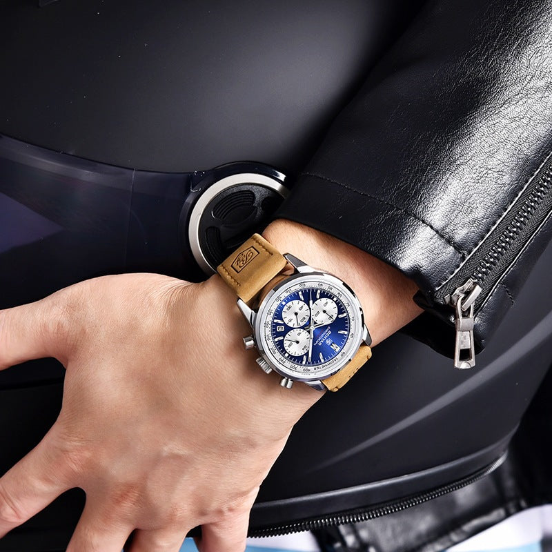 Blue-dial BENYAR quartz watch with tan strap worn on a wrist beside a black jacket