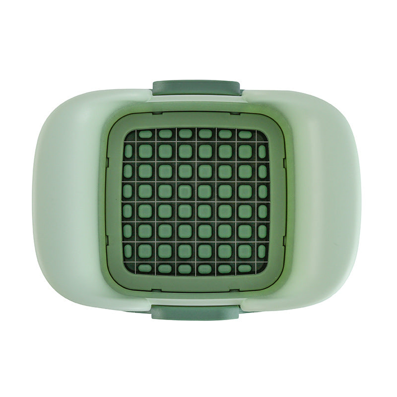Green chopper blade grid insert inside the onion cutter base container
