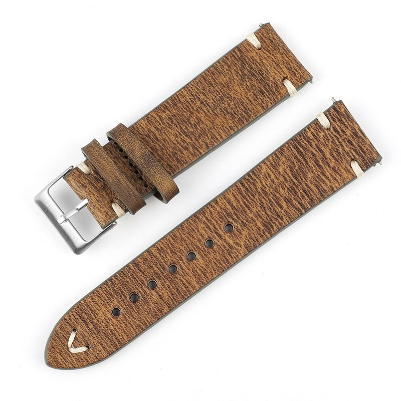 Light brown patterned leather watch strap with silver buckle and perforated adjustment holes