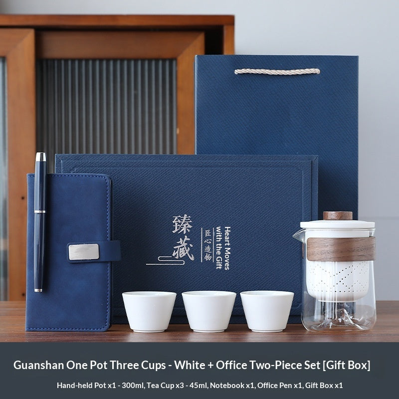 Blue office gift set with notebook, pen, and white tea cups plus tea pot in box