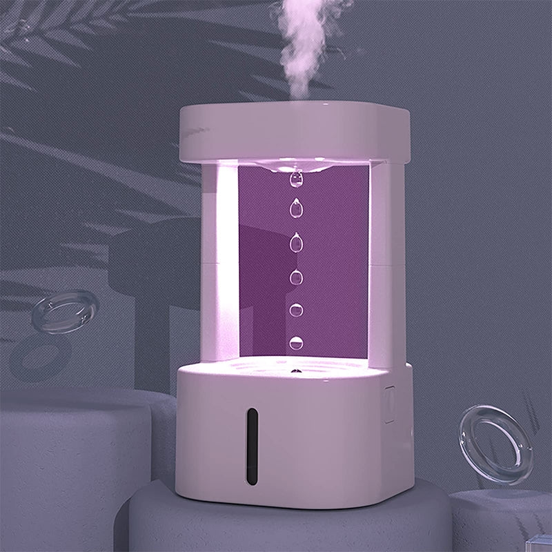 White anti-gravity humidifier with purple interior lighting and mist rising from top