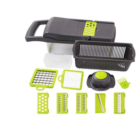 Black vegetable cutter slicer with green accessories and grating/dicing inserts