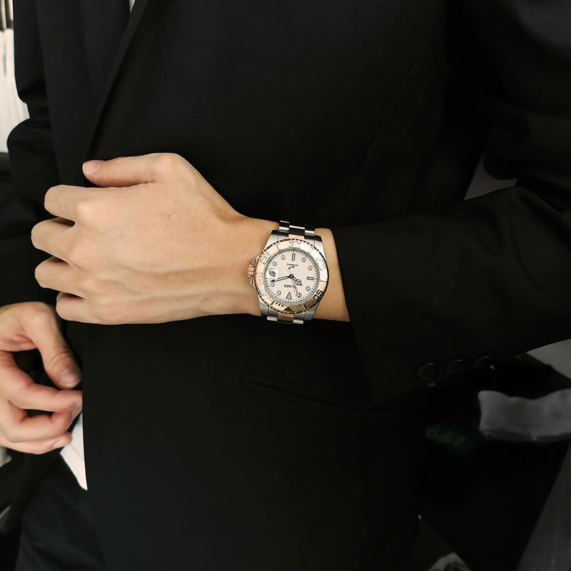 Two-tone automatic mechanical watch on wrist with white dial and metal link bracelet