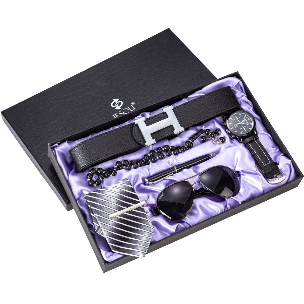 Men's gift set six-piece, black belt and watch in open decorative box with accessories.