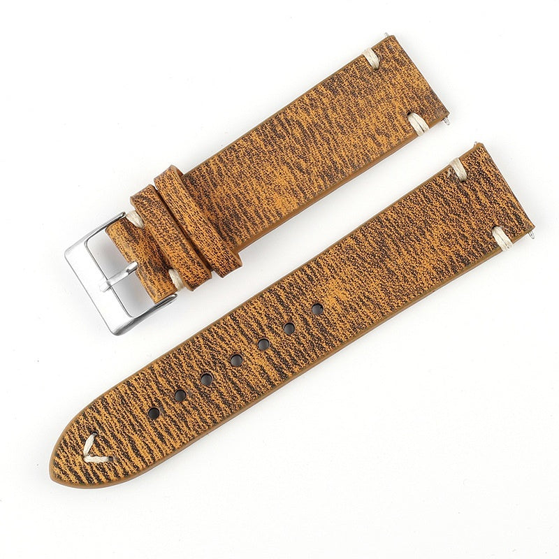 Brown patterned leather watch strap with metal buckle and multiple adjustment holes
