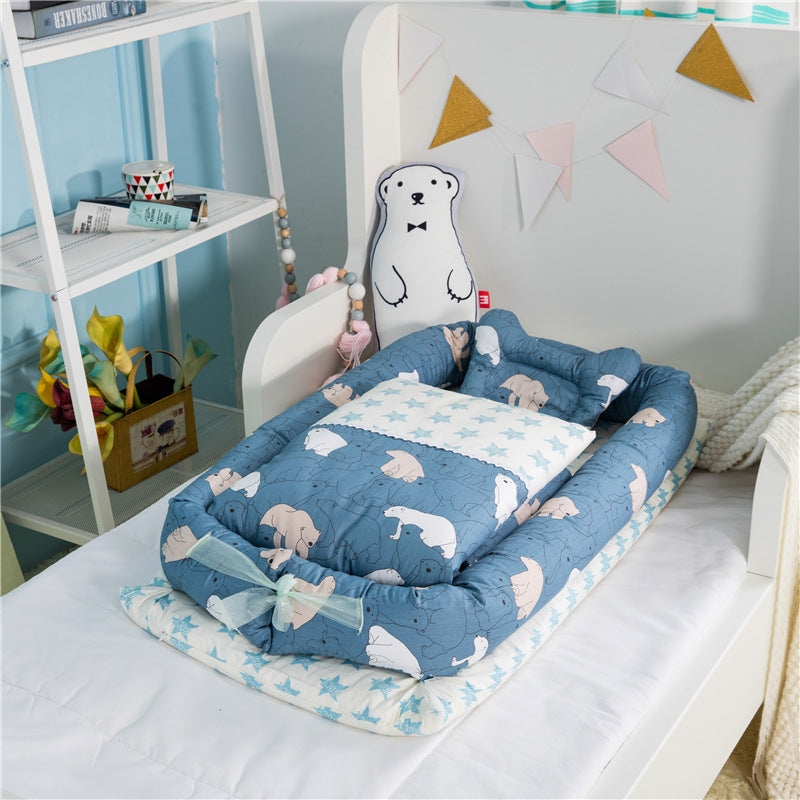 Portable baby nest with blue animal pattern mattress and two-piece pillow set