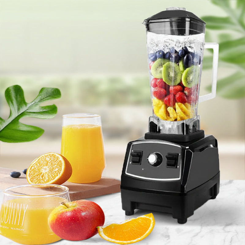 Black countertop blender with clear jar filled with fruit and vegetables