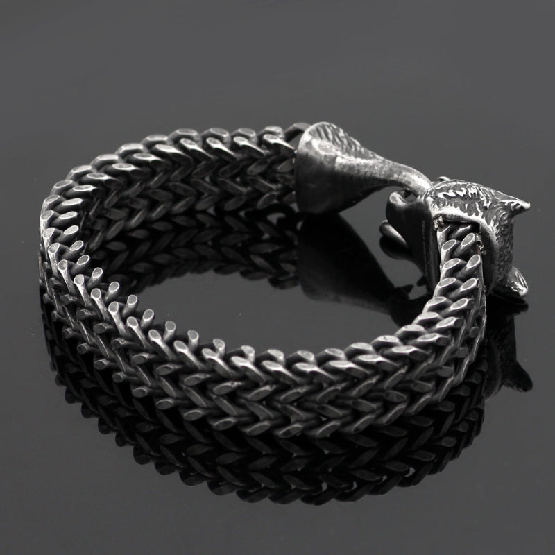 Black braided stainless steel bracelet with silver-toned animal-head charm ends