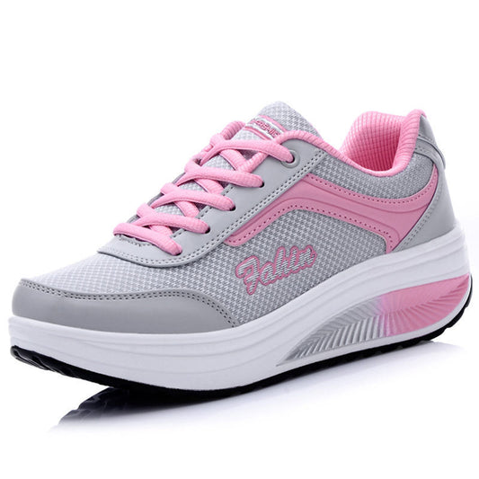 Gray and pink running shoe with 'Pelle' branding on a white background