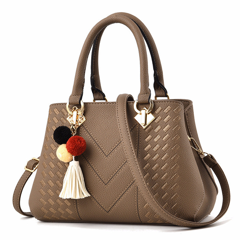 Women's crossbody handbag, khaki PU leather with pom tassel charm and gold-tone hardware