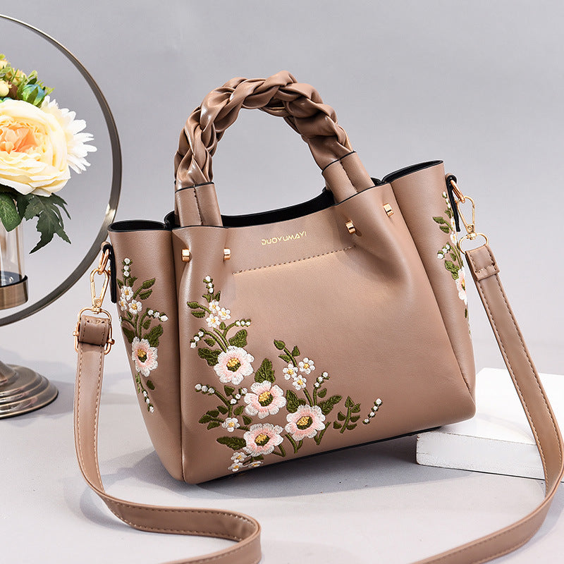 Floral PU handbag tote in taupe with braided top handles and long crossbody strap