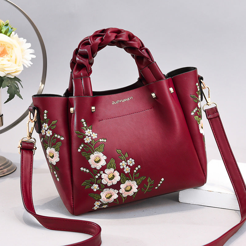 Floral PU handbag tote in wine red with braided handles and crossbody strap