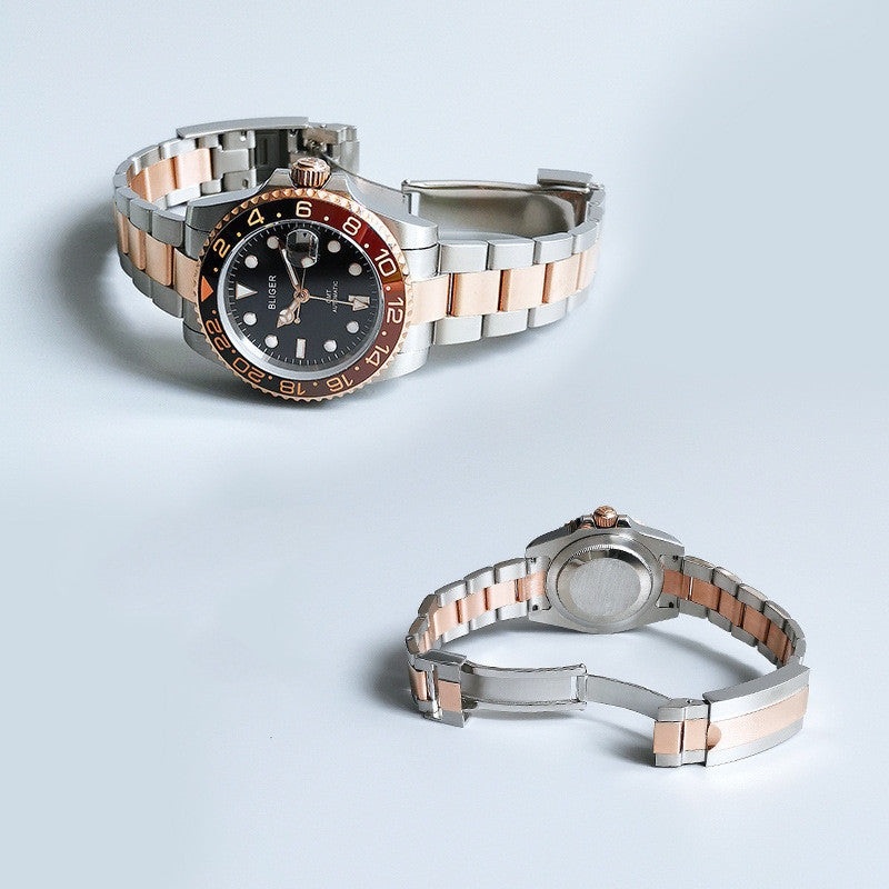 Two-tone automatic mechanical watch with black dial, metal bracelet, orange bezel accents