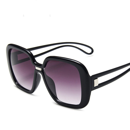 Black sunglasses with gradient lenses on a white background