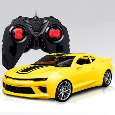 Remote control racing car toy with yellow body and black controller, silver wheel rims.