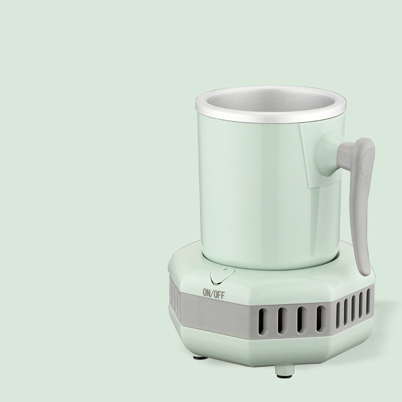 Mint-green mini ice cooling cup with side handle on gray vented power base