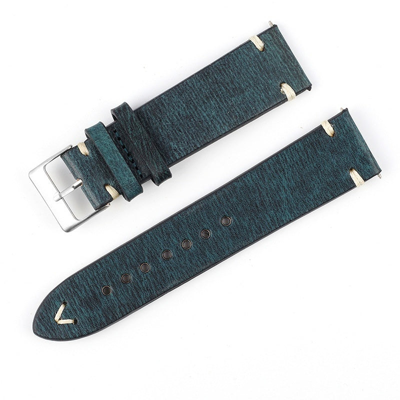 Teal patterned leather watch strap with silver buckle and perforated adjustment holes