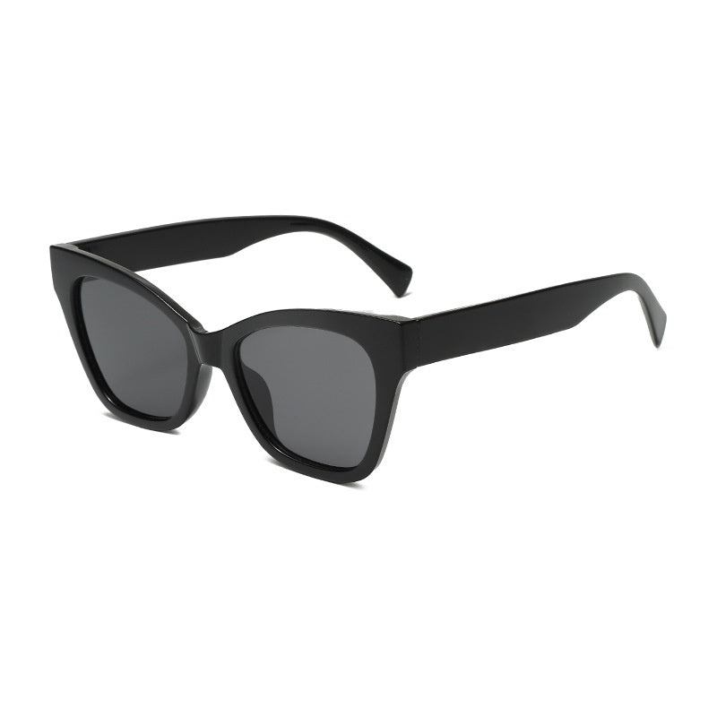 Black sunglasses with gray-tinted lenses and minimalist angular frame