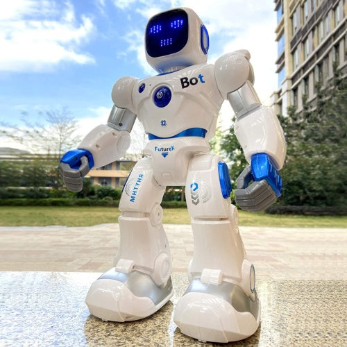 White robot toy with blue eyes, standing outdoors on a pavement surface