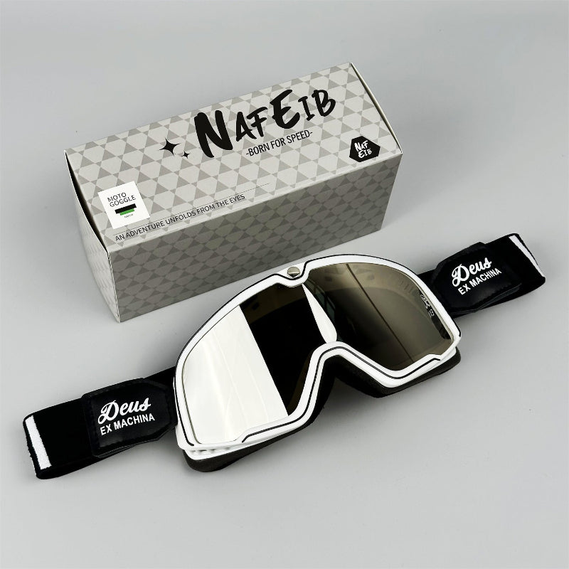 Motorcycle sport goggles with white frame, tinted lens, and black strap with logo patch