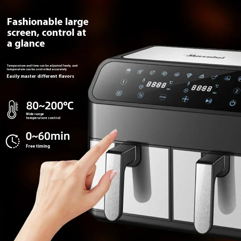 Double-pot air fryer with touchscreen-style panel and dual stainless baskets, hand on controls