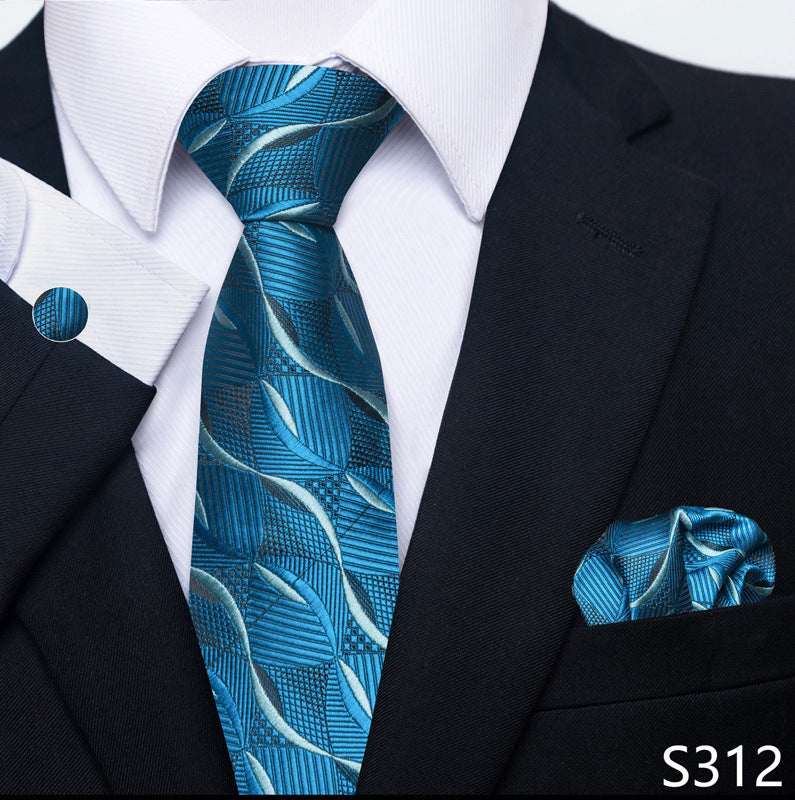 Bright blue textured leaf-pattern tie set with matching pocket square and round cuff links.