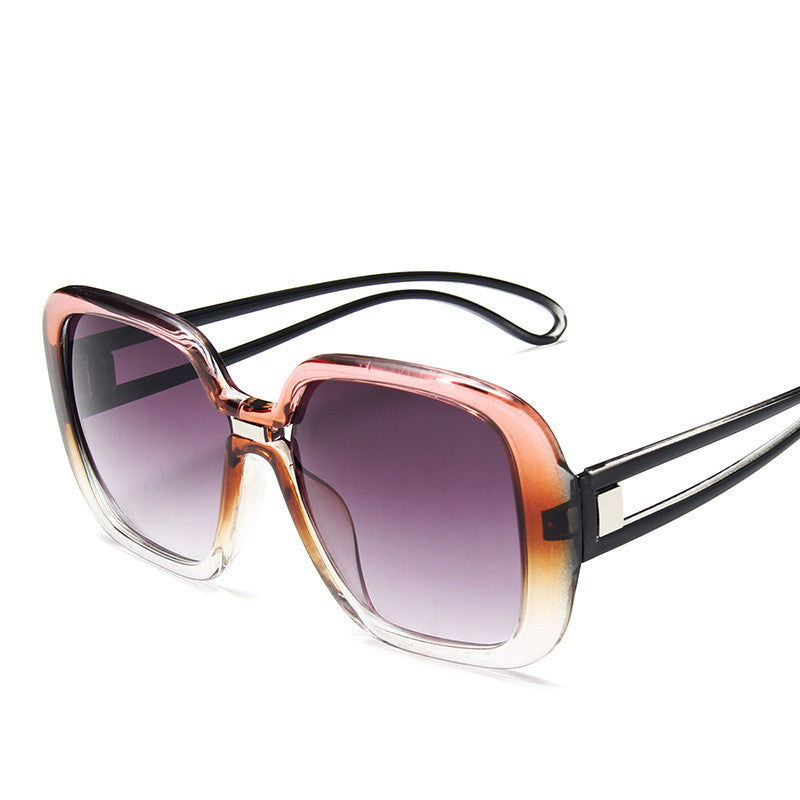 Large square sunglasses with pink-to-rose gradient frame and dark purple tinted lenses