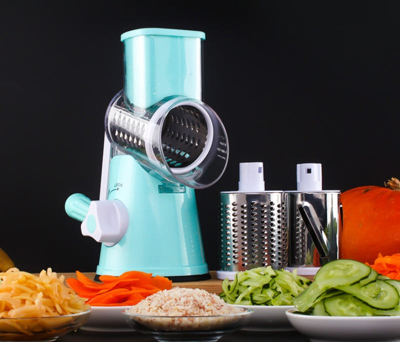 Blue rotary vegetable slicer with stainless grating drum and safety handle