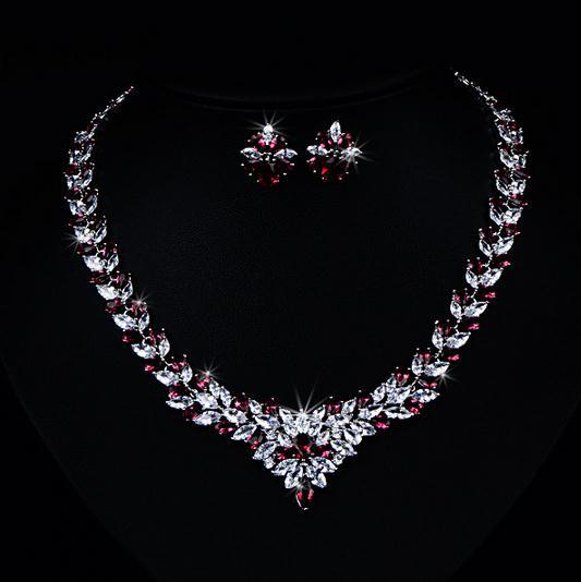 Rhinestone flower necklace and stud earring set with red and clear stones