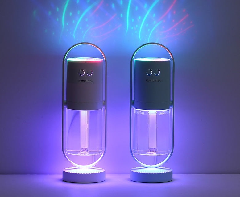 Two dark blue USB humidifiers with purple and blue LED glow and clear tanks