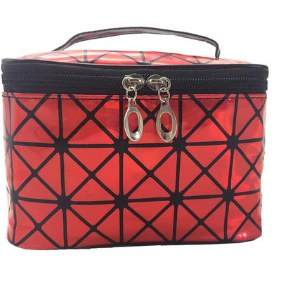 Holographic cosmetic bag in red with black zipper, silver hardware, and geometric pattern