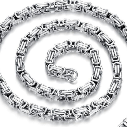 Silver chain necklace on a white background