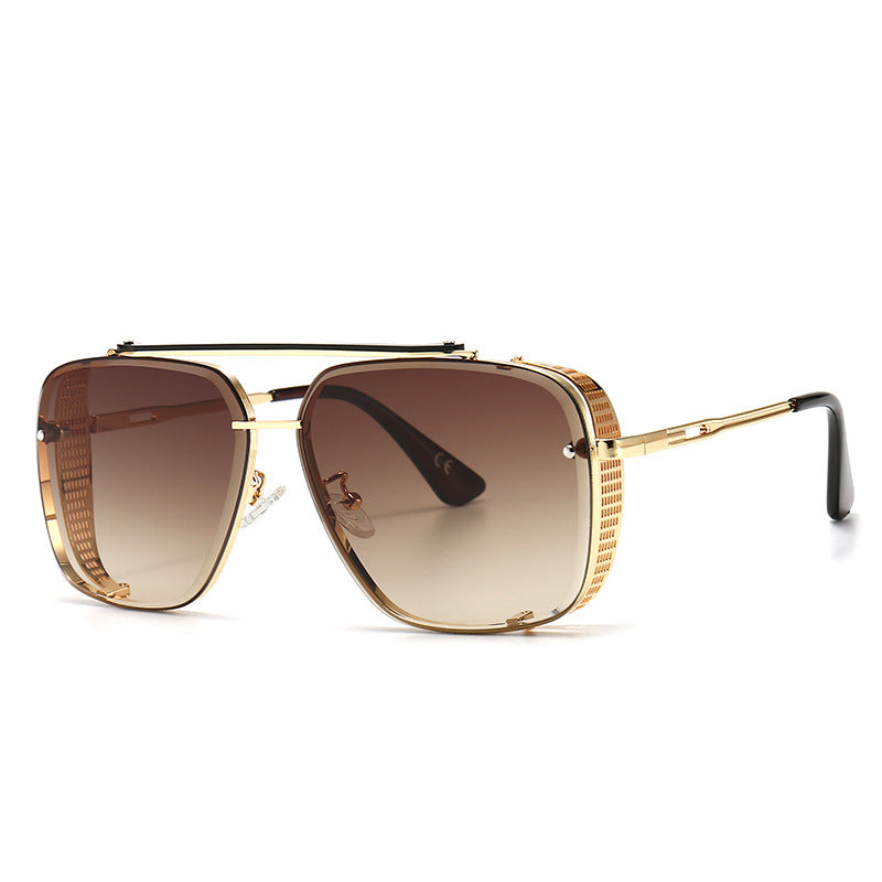 Oversized square sunglasses with brown gradient lenses and gold-tone frame