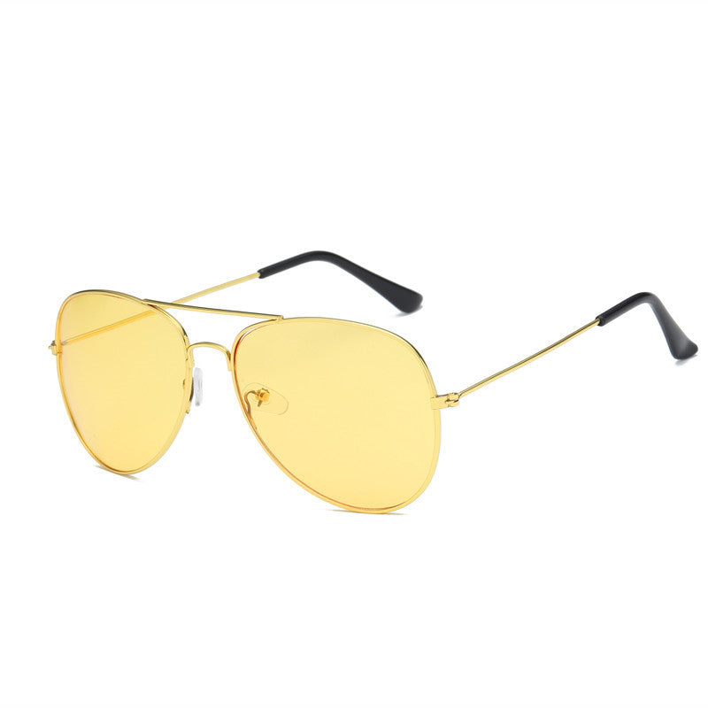 Unisex sunglasses with gold frame and yellow tinted lenses, angled side view