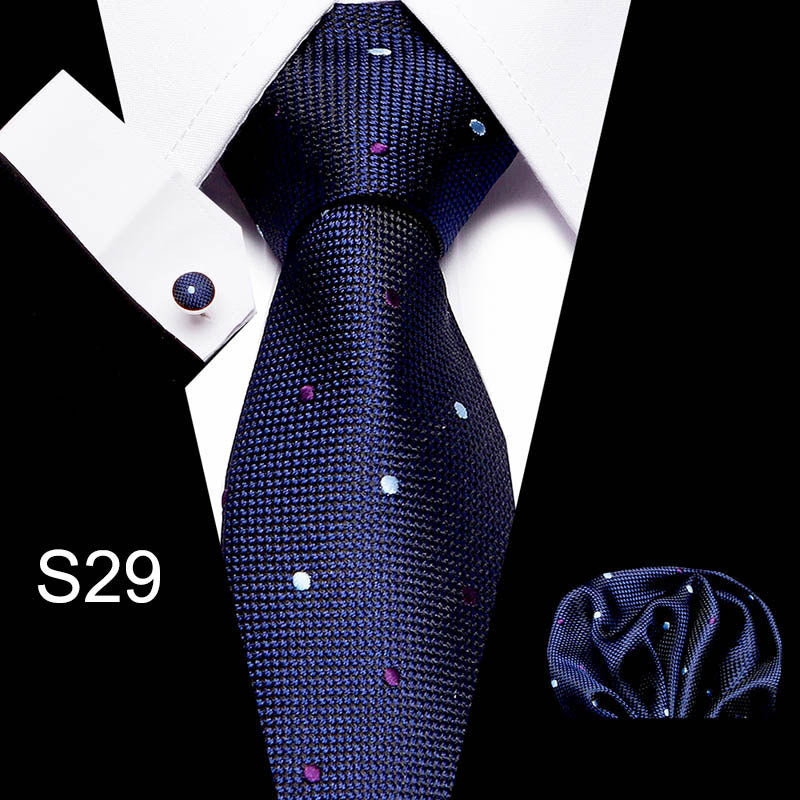 Men's business tie in dark navy with small dot pattern