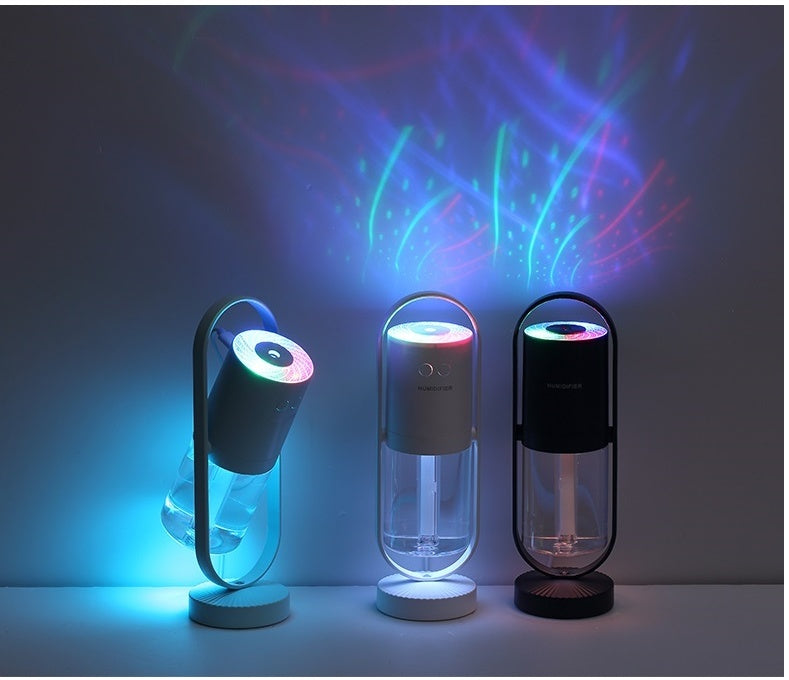 Set of three USB humidifiers with colorful LED lights and clear mist tanks