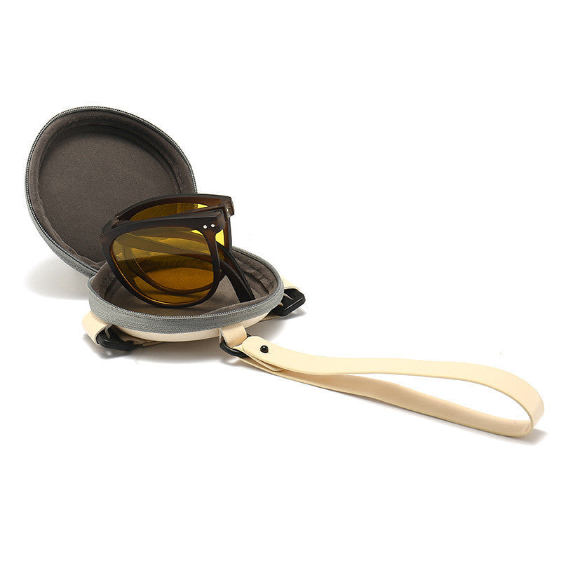 Polarized folding sunglasses for women with amber lens and case