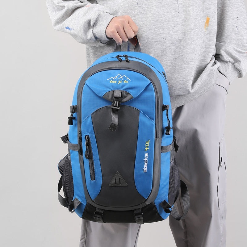 Outdoor polyester backpack in bright blue and dark gray with zip front pocket and straps.