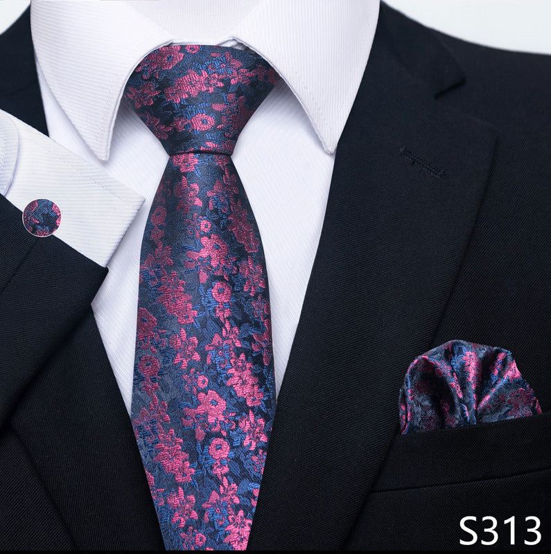 Navy and magenta floral tie set with matching pocket square and round cuff links.