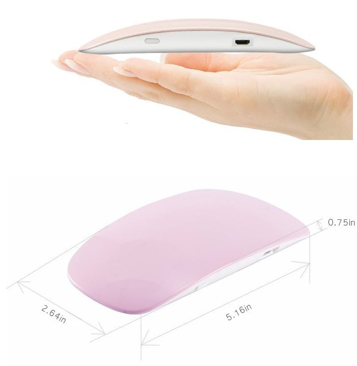 Pink portable USB LED nail lamp held in a hand for compact portability