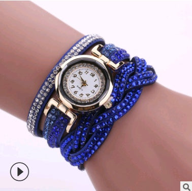Women’s diamond twisted bracelet quartz watch with blue jeweled strap