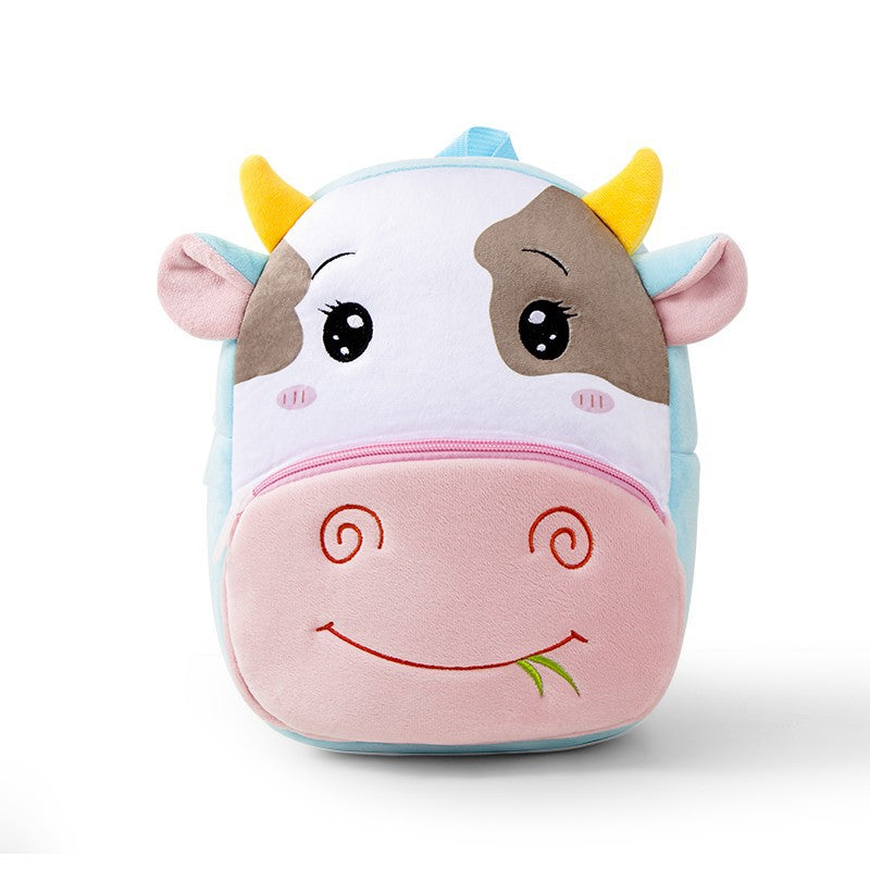 Plush kids backpack with smiling cow face, horns, and pink belly zipper pocket