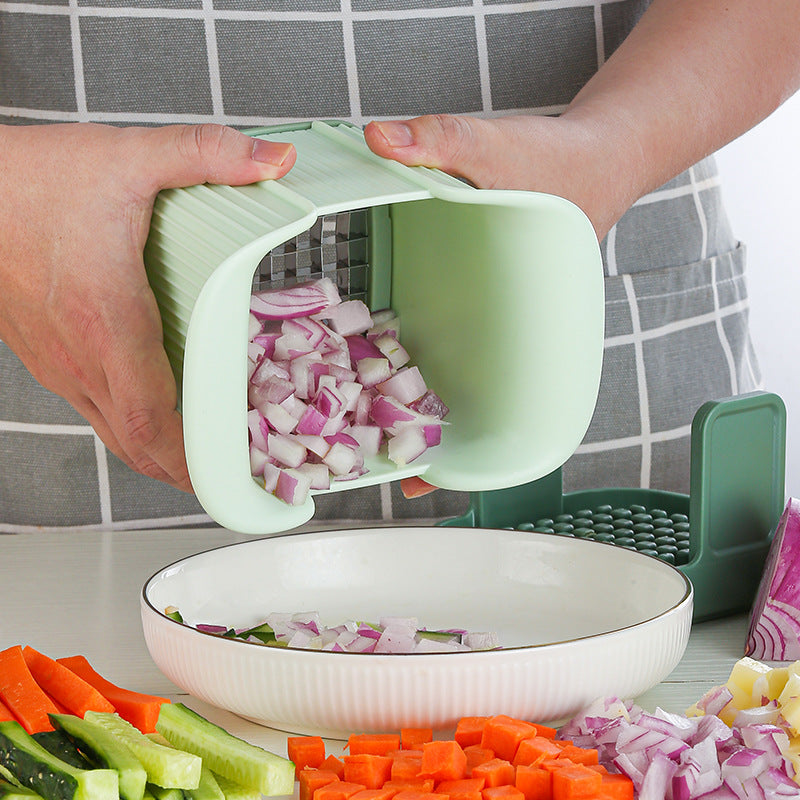 Green onion cutter pouring diced purple onions into a bowl from the scoop lid