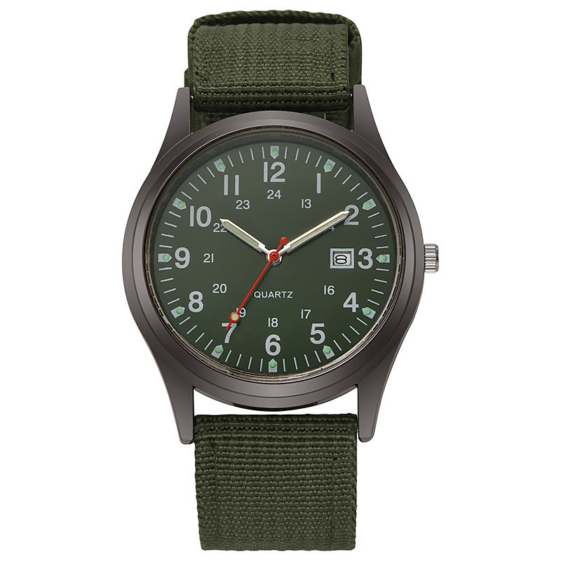 Quartz wristwatch with olive canvas strap and dark green dial, date window at 3 o’clock.