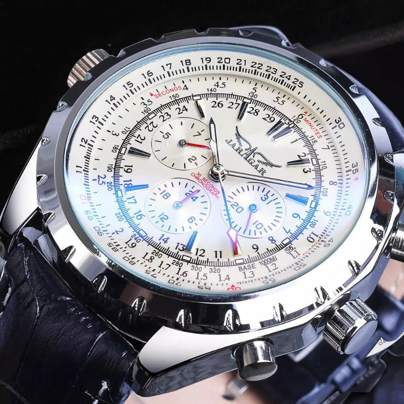 Close-up of a detailed wristwatch with a black strap and silver case.