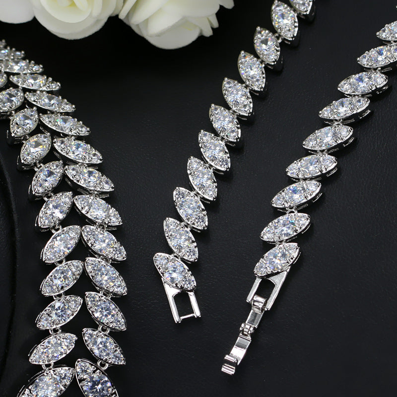 Two-piece AAA zircon set close-up: marquise-crystal tennis bracelet with teardrop drops