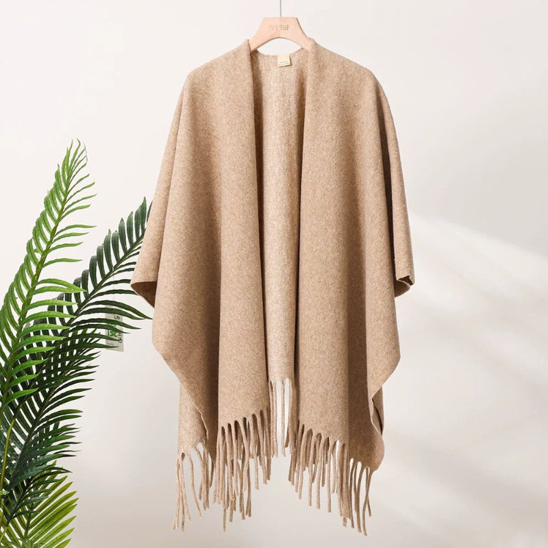 Oatmeal beige tassel-fringe travel cape with wide drape and open neckline