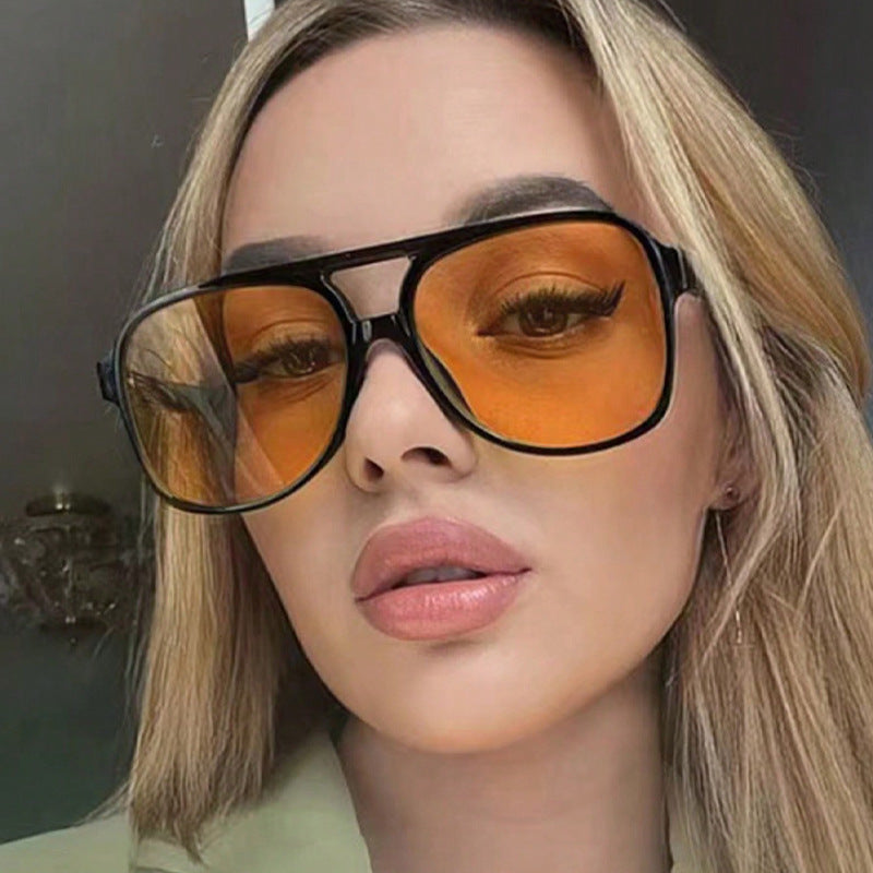 Unisex polarized sunglasses, black frame with amber tinted lenses